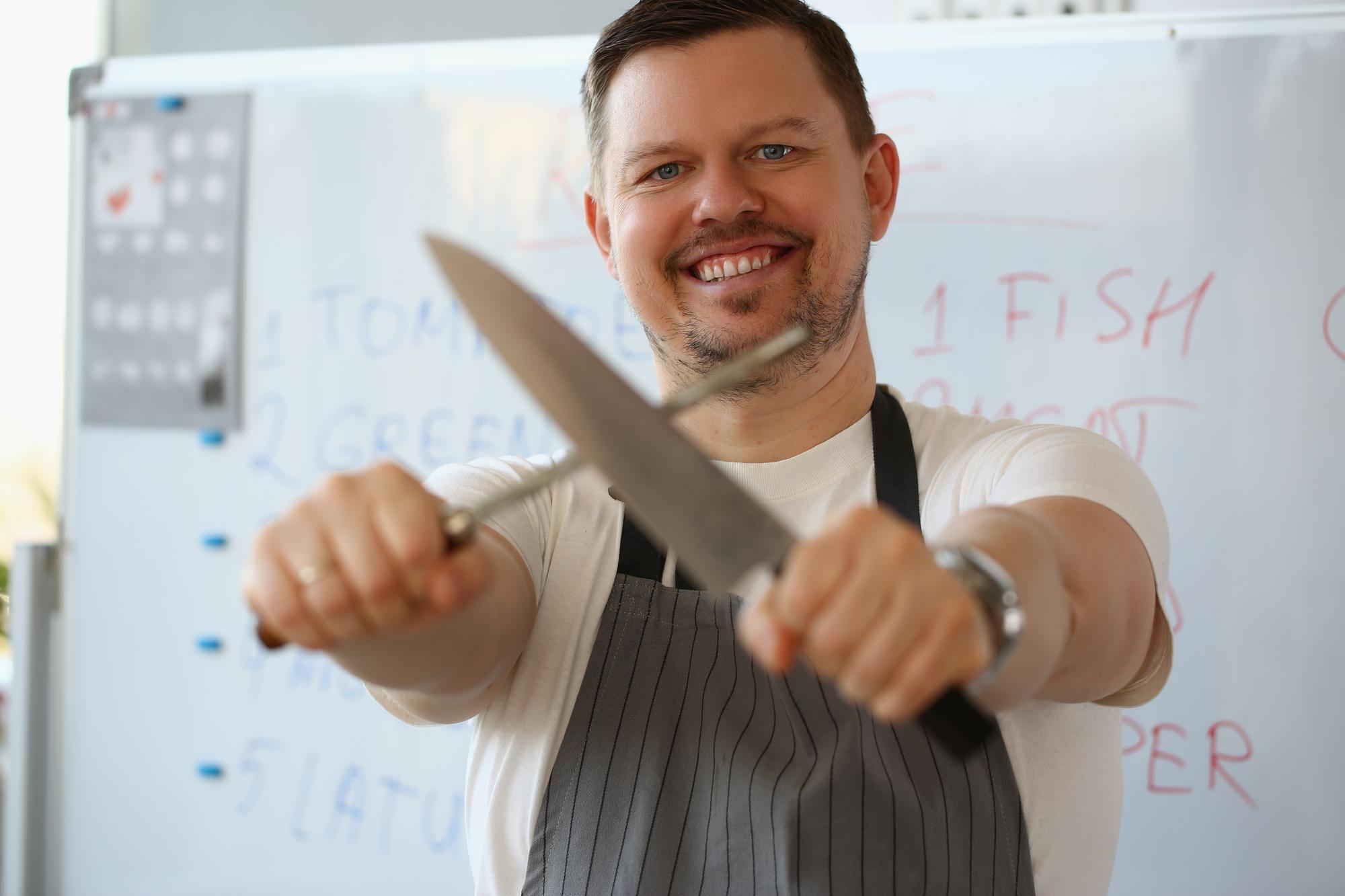 Instructor demonstrating knife technique to a small group