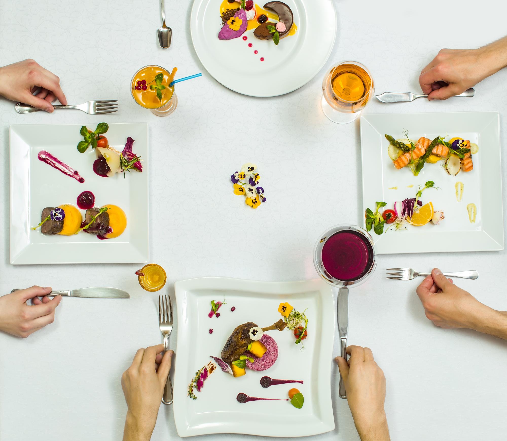 Finished plated dishes arranged on a communal table